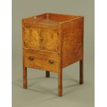 An early 19th century mahogany bedside cabinet,