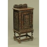 A Victorian carved oak side cabinet, with rear upstand,