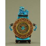 A 19th century French faience mantle clock,