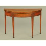 A George III mahogany demi lune tea table,