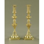 A large pair of Victorian polished brass candlesticks. Height 30 cm.