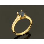 An 18 ct gold sapphire and diamond ring, sapphire +/- 1.05 carats. Size K (see illustration).