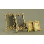 A pair of moulded brass photograph frames,