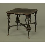 An Edwardian ebonised and shaped window table,