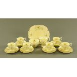 A Crown Staffordshire daffodil patterned half tea set, comprising six cups, six saucers, six plates,