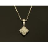 An 18 ct white gold pendant on chain, set with diamonds weighing +/- 0.34 ct.