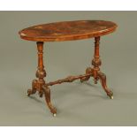 A Victorian inlaid walnut oval centre table,