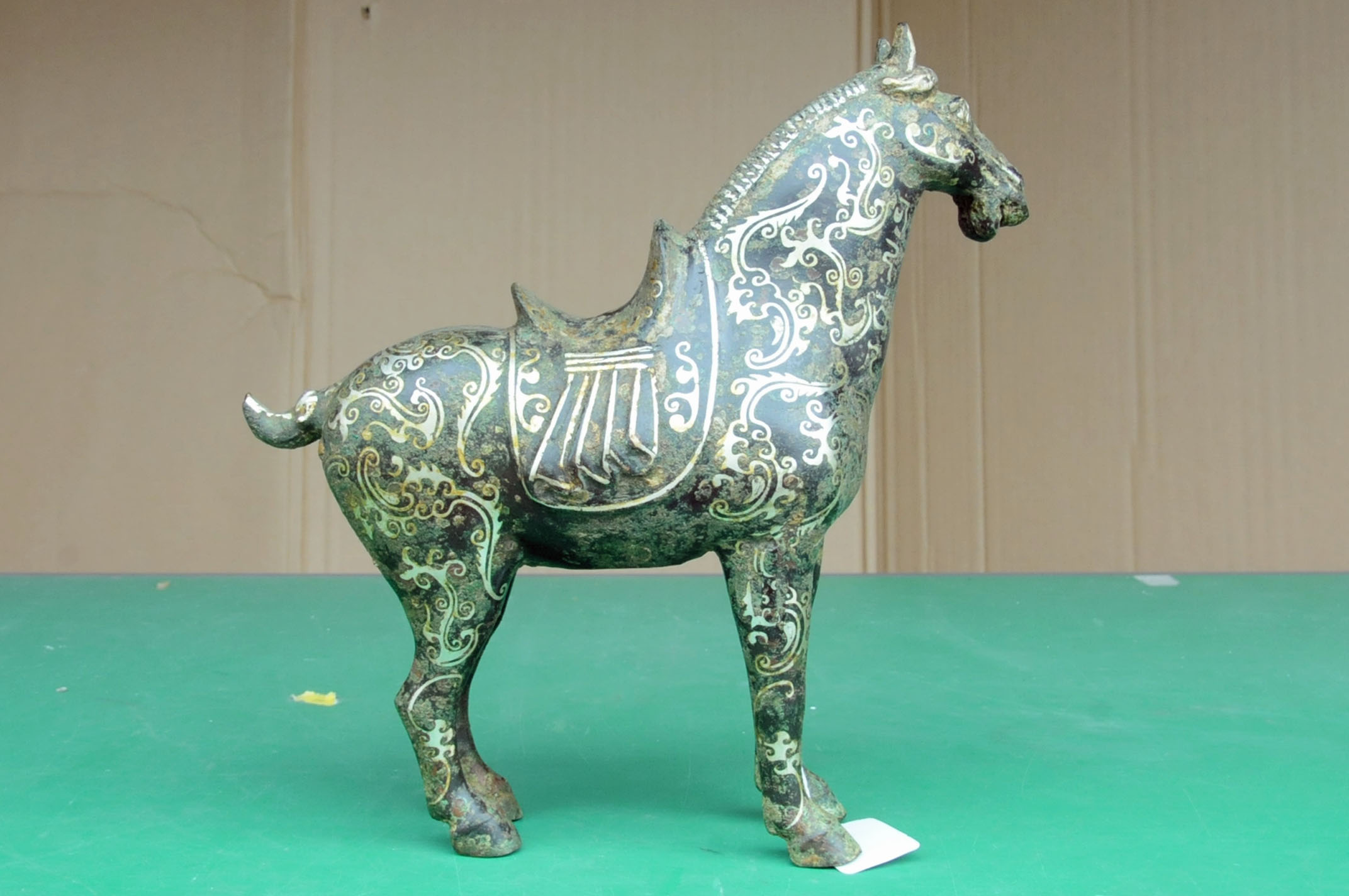 A Chinese bronze figure of a standing horse, with silver coloured metal inlay. Height 29. - Image 4 of 10