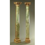 A pair of antique teak columns, with carved capitals,