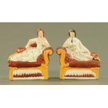 A pair of Staffordshire figures, male and female mandolin players each seated on a couch.