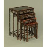 A quartetto of Chinese tables, each with pierced frieze and raised on turned and carved supports.