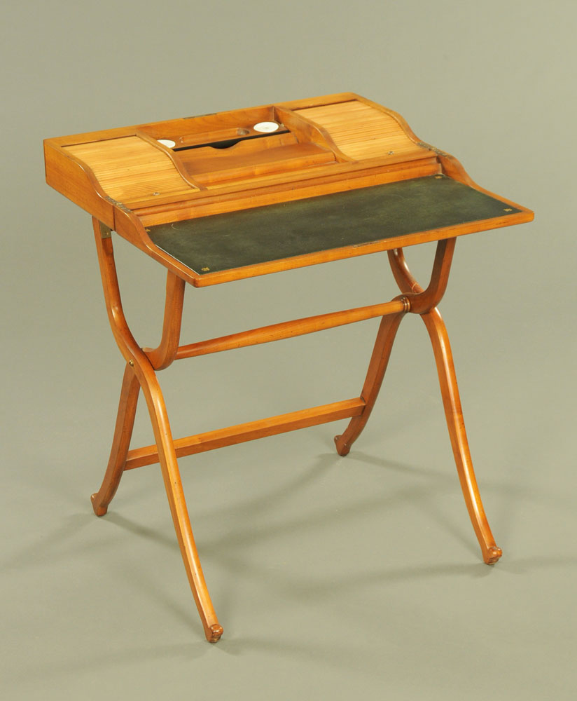 A late Victorian mahogany folding writing desk, opening to inkwells,