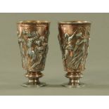 A pair of copper plated goblets, relief moulded with classical figures. Height 15 cm.