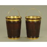 A pair of George III style over size mahogany brass bound peat buckets,