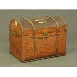 A large 19th century brown canvas covered domed top trunk, the lid initialled C.M.S.