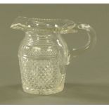 A 19th century hobnail cut glass jug. Height 16 cm.