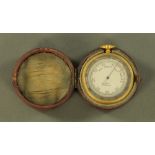 A pocket barometer by MTC London, cased. Diameter 50 mm.