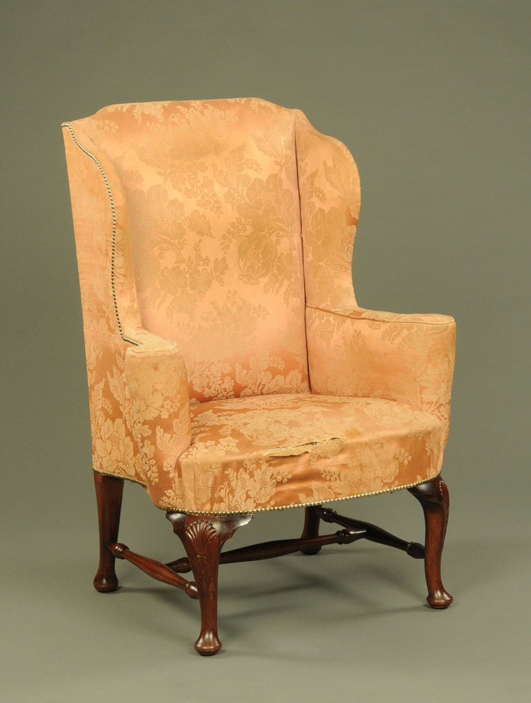A George III wing easy chair,