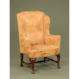 A George III wing easy chair,