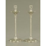 A pair of Sheffield silver modernist candlesticks, 2005 with filled bases, maker Broadway & Co.