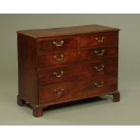 A George III mahogany chest of two short and three long graduated drawers,