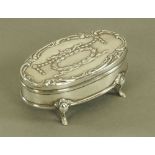 An Edward VII silver mounted oval jewellery box, Chester 1908, length 9.5 cm.