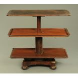 A William IV mahogany three tier dumb waiter, with rise and fall action,