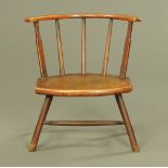 A 19th century oak low occasional chair, with bowed top rail, solid seat and angled legs.