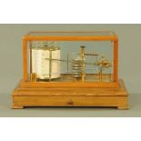 An early 20th century light mahogany and bevelled glazed cased barograph, retailed by Harrods,