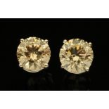 A pair of 18 ct white gold diamond stud earrings, total diamond weight +/- 2.13 ct.