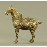 A Chinese bronze figure of a standing horse, with silver coloured metal inlay. Height 29.