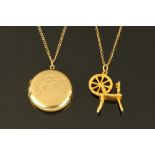 A 9 ct gold locket and chain, together with a spinning wheel charm, all hallmarked or stamped, 10.