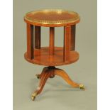 An Edwardian inlaid mahogany revolving bookcase,