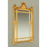 A gilt painted wood and composition framed mirror,