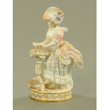 A Meissen figure of a female card player, 19th century after the model by Michel Victor Acacier,