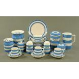 A quantity of TG Green & Co blue and white Cornish ware, including jug, flour bin, various sifters,