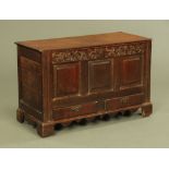 An 18th century oak coffer,