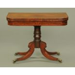 A Regency mahogany and rosewood crossbanded turnover top games table. Width 92 cm.