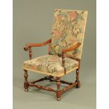 An early 20th century armchair, with upholstered back and seat,