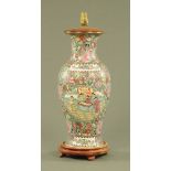 A large Chinese Famille Rose Cantonese table lamp, with wooden stand and base.