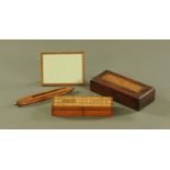 A Victorian walnut cribbage box, containing dice, pegs and playing cards.