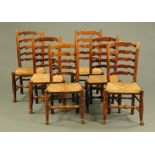 A matched set of six 19th century rush seat ladder backed dining chairs,