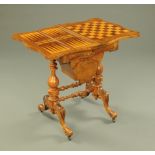A Victorian walnut combined games and worktable, cribbage, backgammon and chess, with sliding bag,
