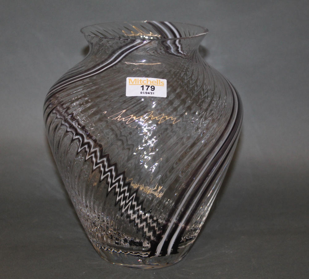 A Caithness clear glass bulbous vase, the spiralled body with white and black streaks,