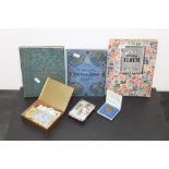 Three small stamp albums and a quantity of loose stamps,