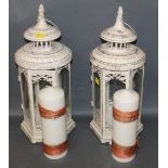 A pair of modern painted metal candle lanterns, of octagonal form,