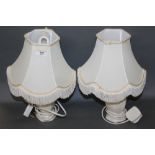 A pair of modern ceramic table lamps with shades