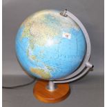 A modern illuminated table globe, 44 cm high.