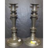 A pair of pewter pillar candlesticks, 25.