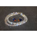 A pair of white metal blue glass and amber leaver back earrings of modernist design together with a